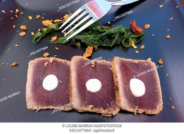 Seared tuna tapas dish at the Bar el Carmen during the 2015 tuna festival in Zahara de los Atunes, Andalucia, Spain