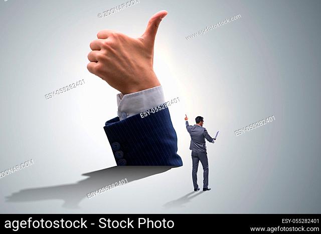 Businessman showing thumbs up gesture
