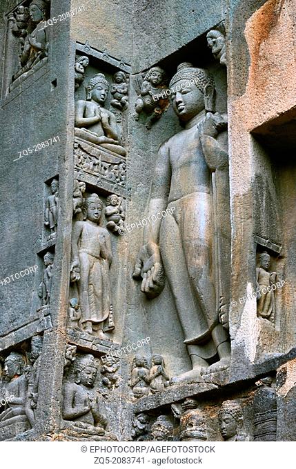 Cave 19 : Right wing of facade showing standing Buddha in Varada mudra. i.e blessings. Ajanta Caves, Aurangabad, Maharashtra, India