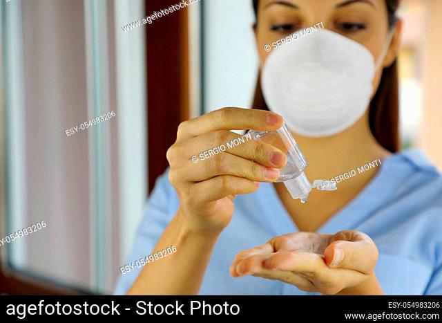 COVID-19 Pandemic Coronavirus mask woman nurse wash hand sanitizer gel dispenser, against Novel coronavirus (2019-nCoV). Home isolation, Auto Quarantine