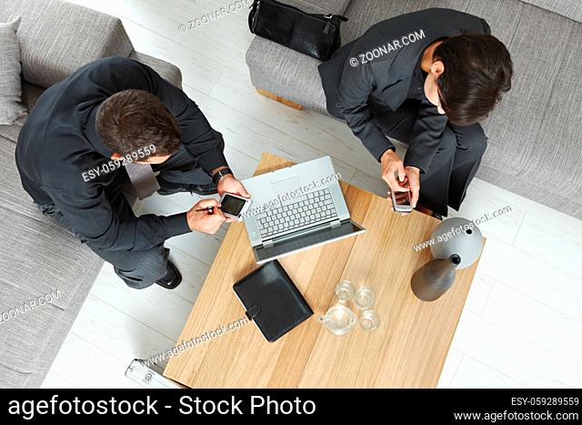 Corporate business people working together on meeting overhead view