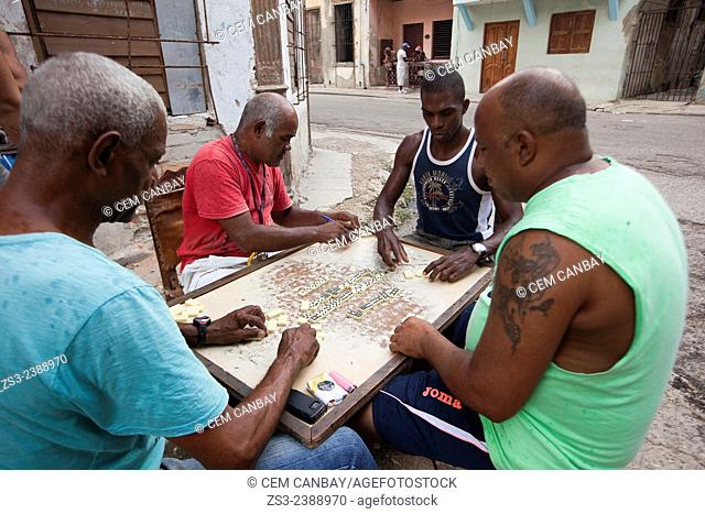 Cuban men playing domino in the street, Havana, Cuba, West Indies, Central America