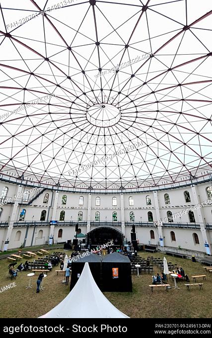 30 June 2023, Saxony, Leipzig: Musicians from the Sinfonia Leipzig ensemble play in an old gasometer in the south of the city