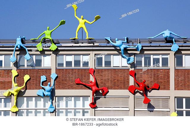 Flossis sculptures by artist Rosalie on the facade of the Roggendorfhaus building, Medienhafen port in Duesseldorf, North Rhine-Westphalia, Germany, Europe