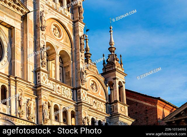 Wonderful marble statues from the Renaissance period of the Pavia Carthusian monastery facade at sunset, Italy. Copy space