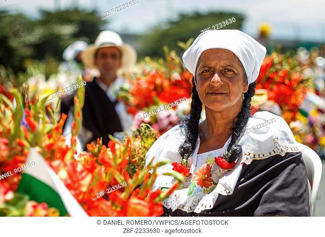 Parade of the silleteros in the city of Medellin, Colombia. Celebrated in august. Peasants loading flowers on your back. Portrait Silletera
