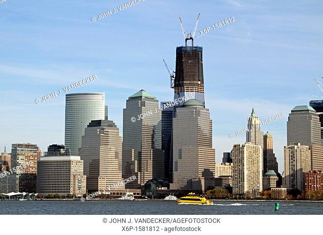 The Freedom Tower under construction and rising from Ground Zero, the scene of the 9/11 terrorist attack  World Financial Center is in the foreground  New York...