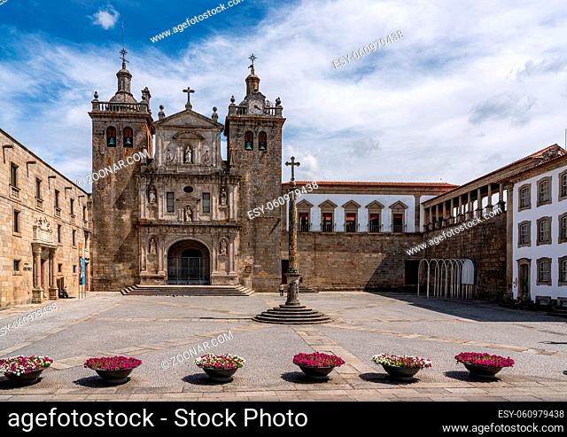 Main cathedral or Se in Viseu with stone cross and large empty square