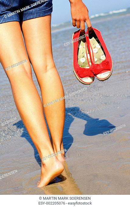 woman walking on beach