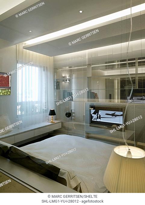 Modern bedroom with flat screen TV