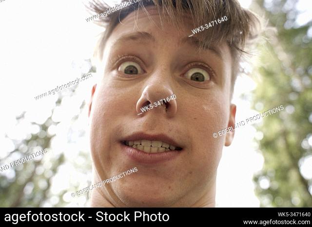 Close-up portrait of young boy in forest. Bad Tölz, Upper bavaria, Germany