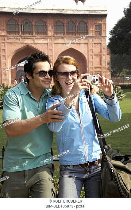 Couple taking pictures at Red Fort, Delhi, India
