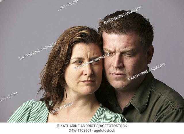 Unhappy married couple feeling anger and disappointment