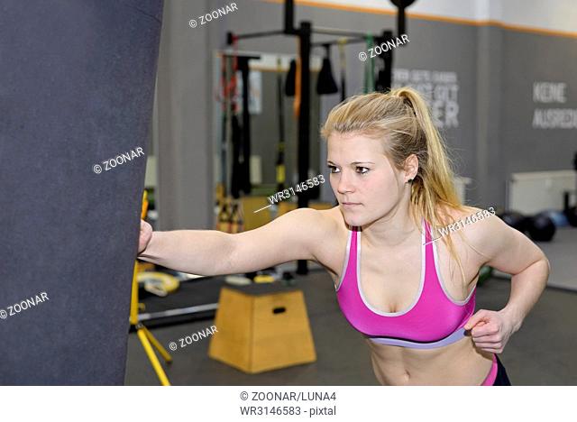 young blond woman boxing