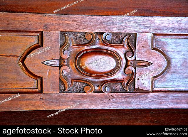 red abstract house door  in italy  lombardy  column the milano old    closed nail rusty