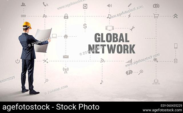 Engineer working on a new social media platform with GLOBAL NETWORK inscription concept