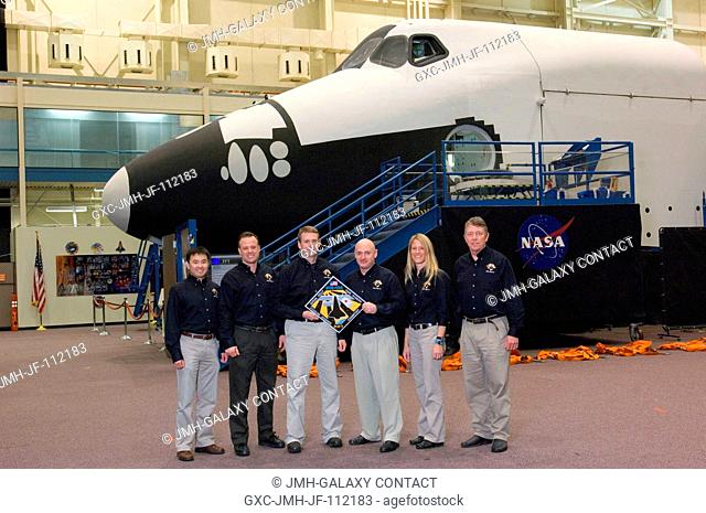 The STS-124 crewmembers take a moment to pose for a portrait during a training session in the Space Vehicle Mockup Facility at the Johnson Space Center