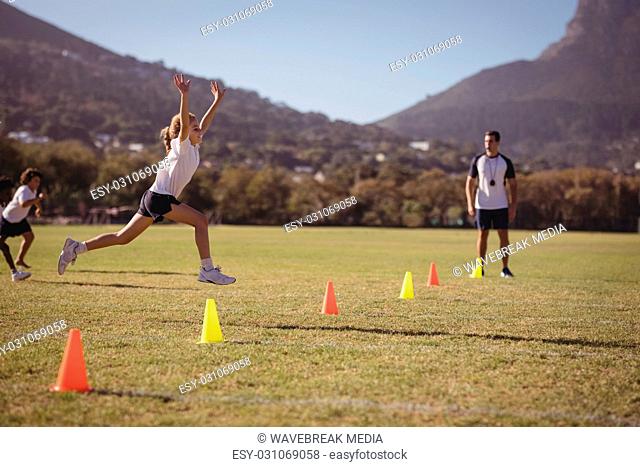 Schoolgirl running towards fining line during competition