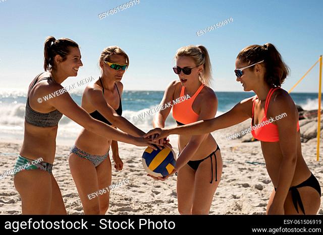 Female volleyball players playing beach volleyball