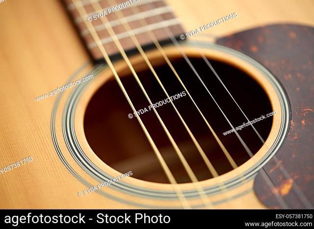 close up of acoustic guitar strings