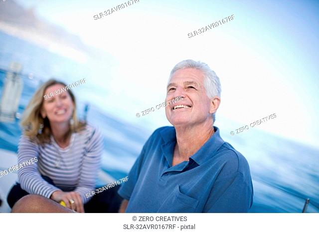 Older couple sitting on boat together
