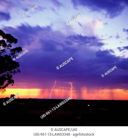 Curtains of rain falling from the base of heavy nimbus clouds, New South Wales, Australia