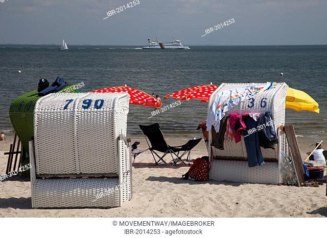 Beach chairs on the beach and a ferry, Wyk auf Foehr, Foehr Island, North Sea, North Frisia, Schleswig-Holstein, Germany, Europe