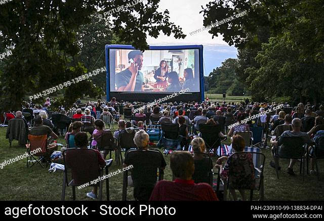 PRODUCTION - 24 August 2023, Brandenburg, Oranienburg: Numerous spectators watch the screening of the film ""Monsieur Claude and his great feast"" in the...