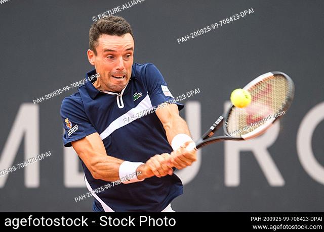 25 September 2020, Hamburg: Spanish tennis player Roberto Bautista Agut in action against Russia's Andrey Rublev during their men's singles quarter-final tennis...