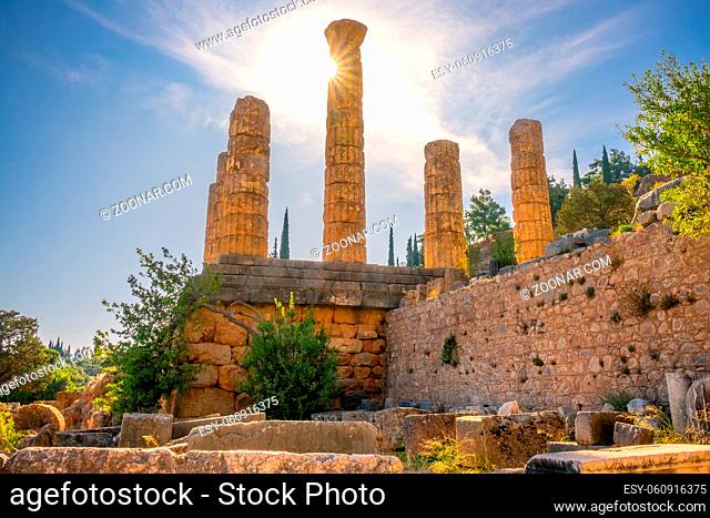 Greece. Delphi. The ruins of ancient buildings and the sun