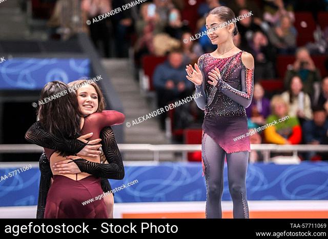 RUSSIA, ST PETERSBURG - MARCH 5, 2023: Figure skaters Yelizaveta Tuktamysheva (bronze) and Kamila Valiyeva (silver) share a hug as Adeliya Petrosyan (gold)