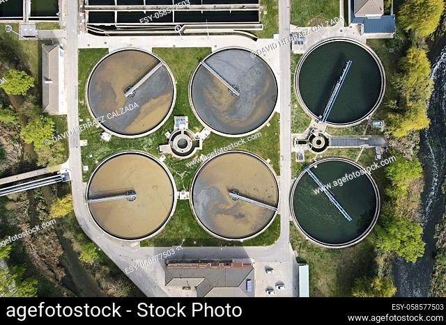 Aerial top view of round polls in wastewater treatment plant, filtration of dirty or sewage water. High quality photo