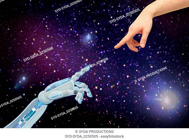 human and robot hands over space background