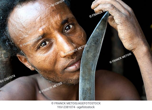 Man belonging to the Kereyu tribe holding his knife ( Ethiopia)