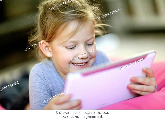 Girl using tablet computer