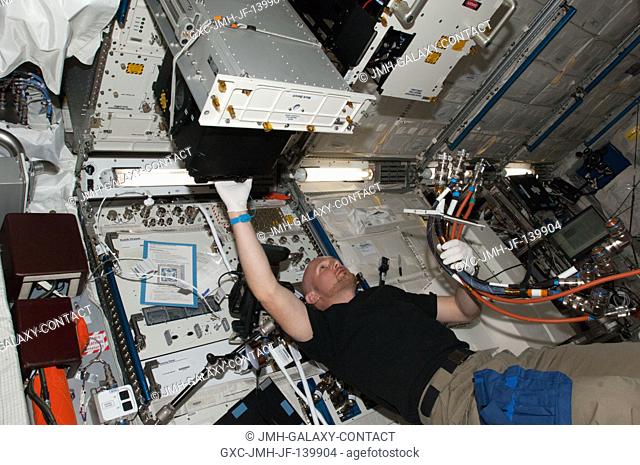 European Space Agency astronaut Alexander Gerst, Expedition 40 flight engineer, works with Fundamental and Applied Studies of Emulsion Stability (FASES)...