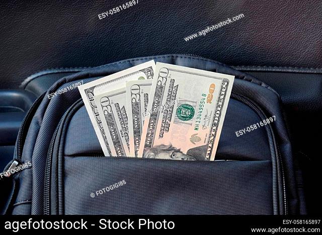 Dollars in the pocket of the bag. American Money