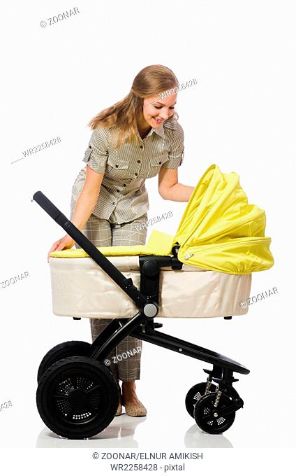 The woman with baby and pram isolated on white