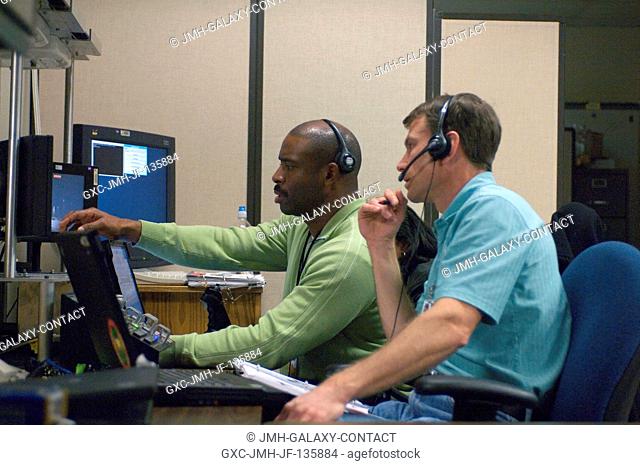 Astronauts Leland Melvin (left) and Stanley Love, both STS-122 mission specialists, use the virtual reality lab at Johnson Space Center to train for some of...