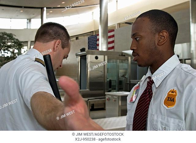 Romulus, Michigan - Employees of the U S  Transportation Security Administration performing security checks at Detroit Metro Airport
