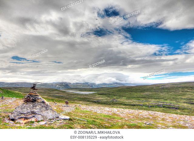 Stack of rocks and Norwegian landscape