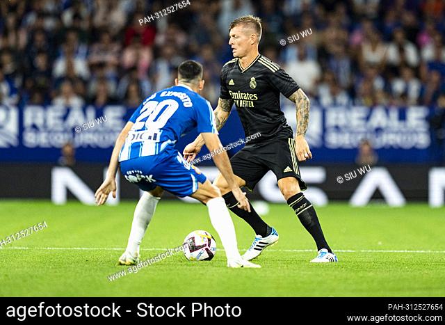 Toni Kroos (Real Madrid CF) duels for the ball against Edu Exposito (RCD Espanyol) during La Liga football match between RCD Espanyol and Real Madrid