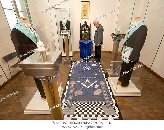 Lodge member Guenther Ahrendt looks at exhibits of the Johannis Masonic Lodge exhibition at the city museum of Weimar, Germany, 20 March 2014