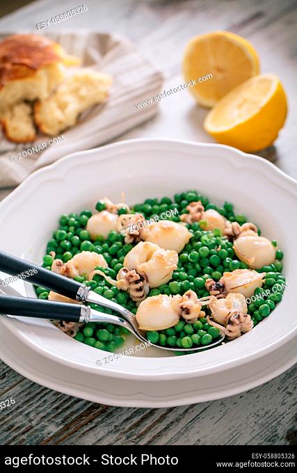 Cuttlefish with peas on a plate. High quality photo