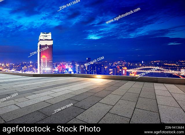 landmark modern office buildings in downtown of chongqing at twilight on view from empty patio