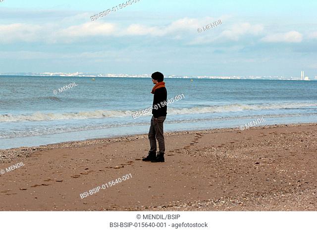 Man strolling on the beach