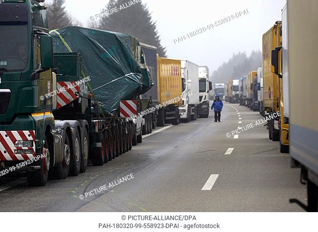 20 March, Germany, Boppard: A long traffic jam forms after a juggernaut carrying beef overturned on the Autobahn 61 (A61) motorway near Boppard