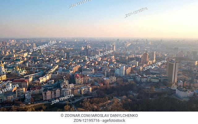 Aerial photography from the drone to the Central House of Artists, Trading house, Peizazhna Alley and districts with chuches and old building houses in the city...