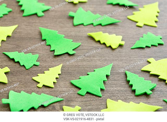 Green tree decorations on table