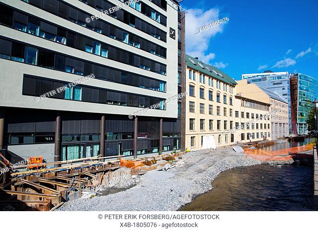 Buildings and parklands in process of being built on the banks of Akerselva river central Oslo Norway Europe